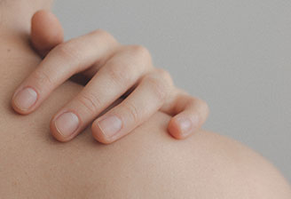 image of a shoulder and hand