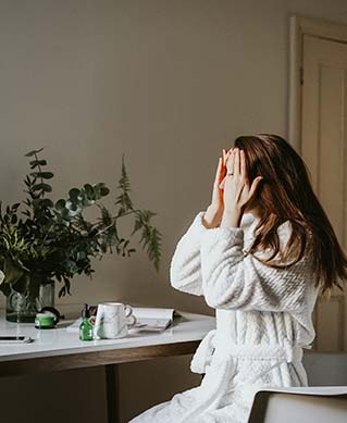 image of a woman in a bathrobe